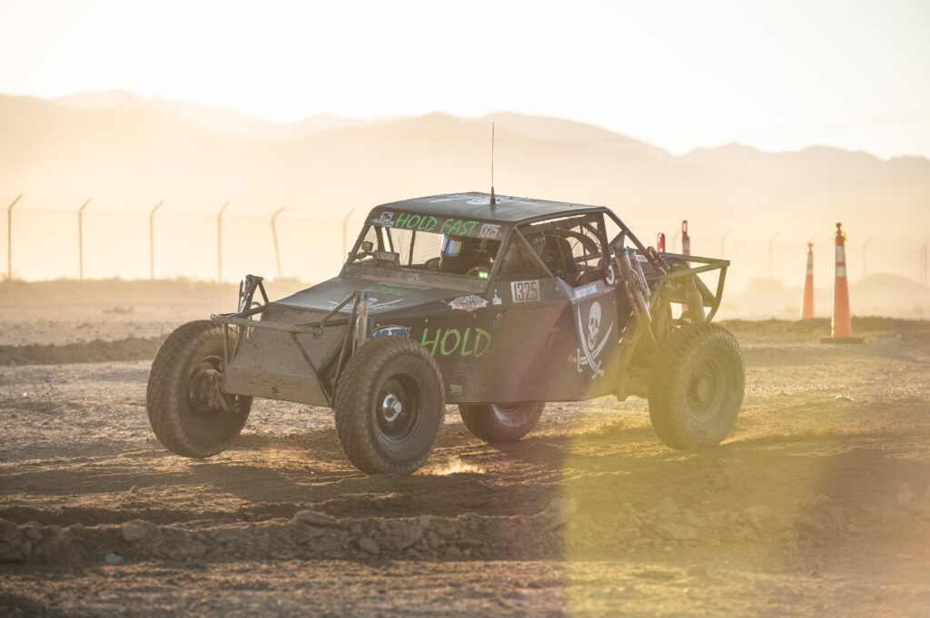 Backlit offroad race car racing the Battle at Primm in Primm nevada. Photo by Rob Wessels off-road photography.