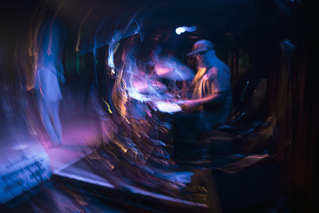 low shutter speed stylized blurry photo of a drummer