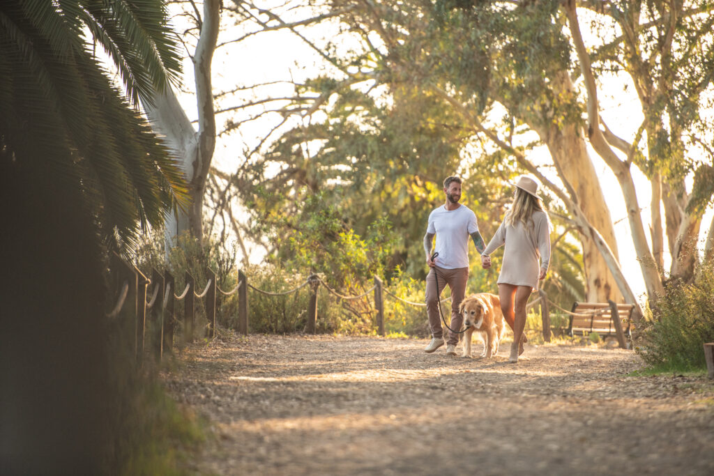 Couple on a sunset walk at the Batiquitos Lagoon in Carlsbad California. Photo by Rob Wessels 
